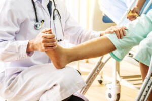 Ankle Specialist examining patients ankle