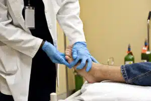 foot doctor Checking the Patient's Foot