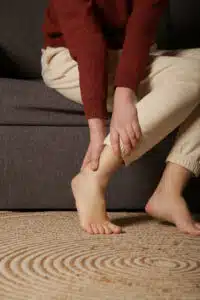 Woman dealing with ankle pain from diabetes disease